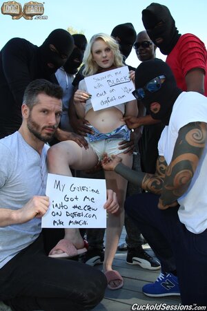 White bitch gets screwed by a crowd of black studs in front of the cuckold dude