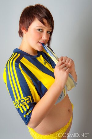 Chubby football fan pulls T-shirt off to show off her big tits and sexy panties