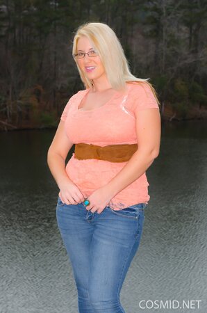 Erotic outdoor session of stunning blonde MILF showing big breasts at the lake