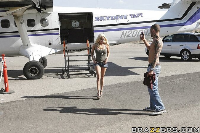 MILF in jean shorts unveils huge breasts and gets humped in the plane