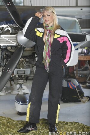 Blonde pilots take off overalls to brag about awesome bodies in the hangar