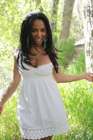 Black hottie takes off white dress to reveal perfect big breasts in the woods