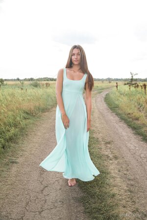 Chick in turquoise dress flashes breasts and cunt on the village road