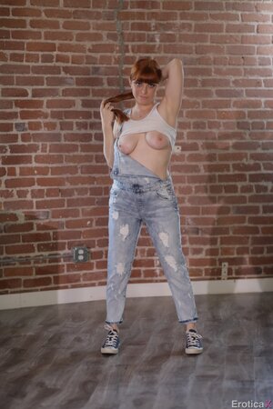 Curvaceous ginger hussy sheds denim overalls to reveal big tits and booty