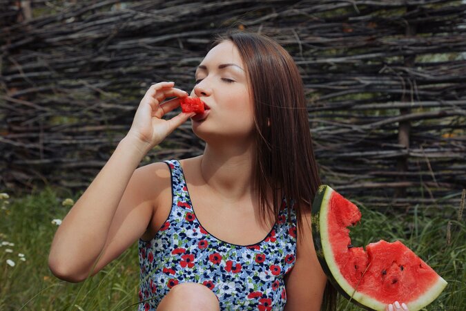 Instead of eating watermelon lovely teen poses naked in the fresh air