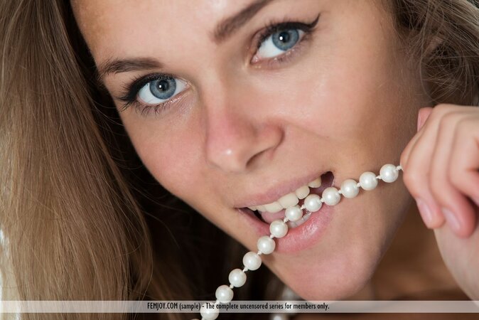 Svelte teen in pearls bends like a cat end exposes her young fit body