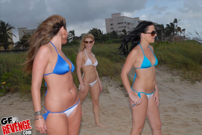 Three sultry babes with sunglasses take a walk with nothing but swimsuits on