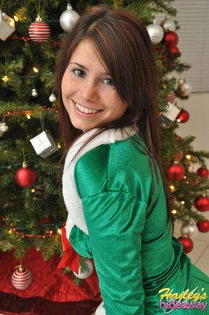 Adorable cutie in Christmas outfit undresses to flaunt her sexy teen curves