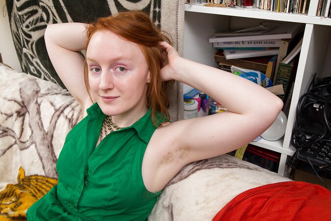 Redheaded firecrotch brushing her pussy hair and looking good