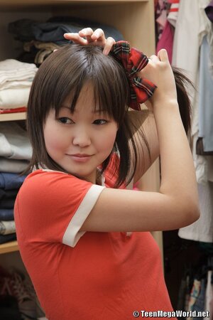 Asian schoolgirl shows upskirt and prepares for hard loving