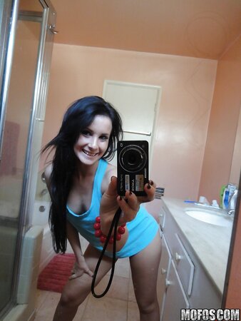 Saucy stunner taking some selfies in the bathroom while stripping