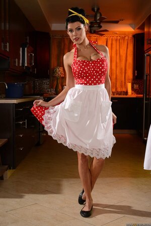 Old-fashioned housewife pulls down polka dot dress to show off her stunning body