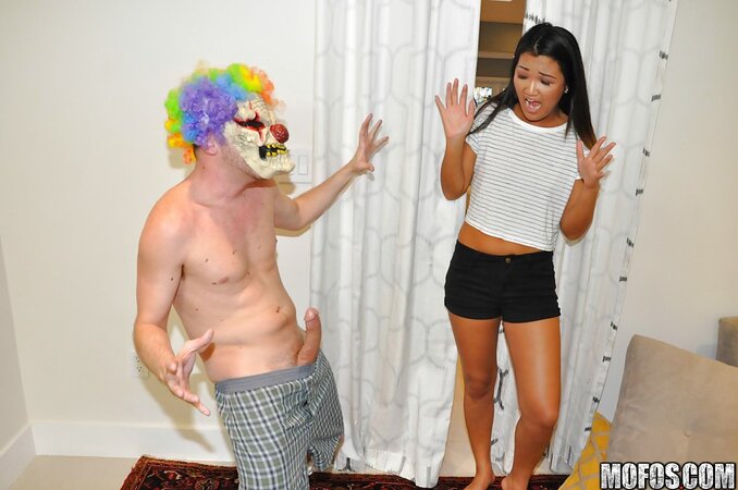 Prankster in scary clown mask stretches Asian girlfriend all over couch