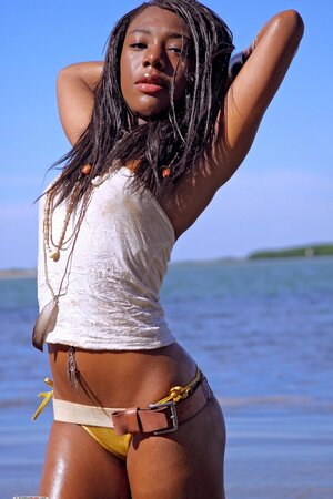 Ebony beauty showcasing her fantastic body on the beach