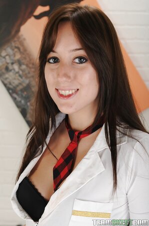 Brunette student with mesmerizing smile showcases her pretty peach