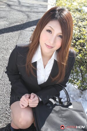 Beautiful Japanese secretary seductively poses while going at her work
