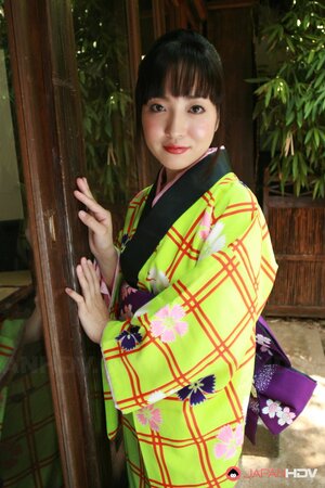 Swanky Japanese woman wears colorful kimono and has no panties under it