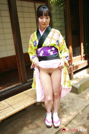 Swanky Japanese woman wears colorful kimono and has no panties under it