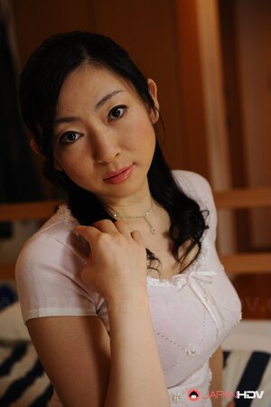 Japanese in a white dress gets horny and doesn't shy to go stepson for sex