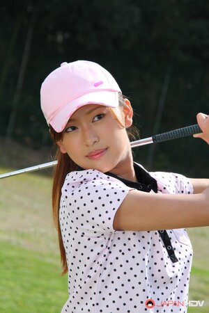 Oriental golf girl wears shirt and skirt but dislikes panties and flashes muff