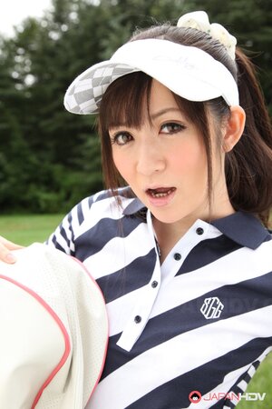Asian cutie combines playing golf with flashing her panties hidden under skirt