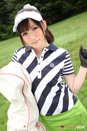 Asian cutie combines playing golf with flashing her panties hidden under skirt