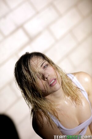 Lia Lor shows her wet small tits after training hard