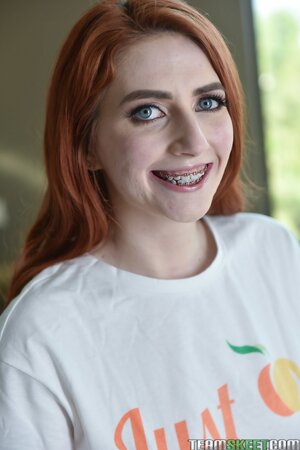 Adorable redhead practicing her jaw moves for big dicks