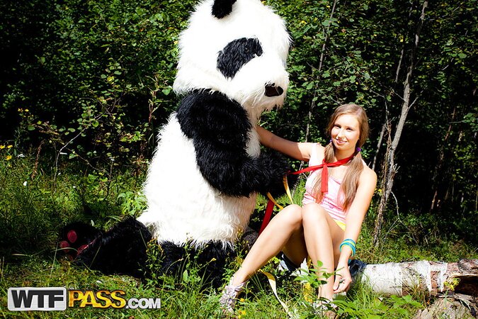 Penny banged by panda on boulder near woods