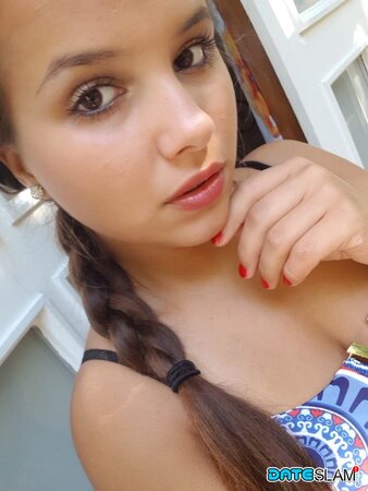 Olivia hides her huge tits while taking cute poolside selfies