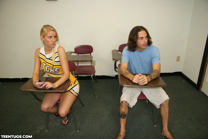 Confident cheerleader jacking off a dude in sandals