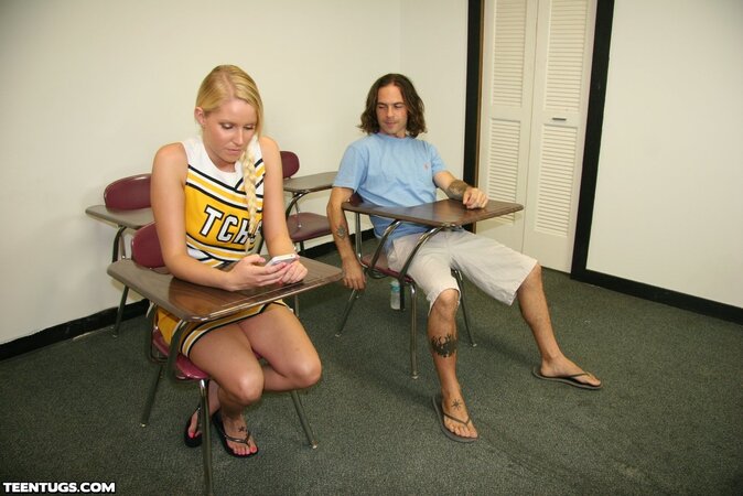 Confident cheerleader jacking off a dude in sandals