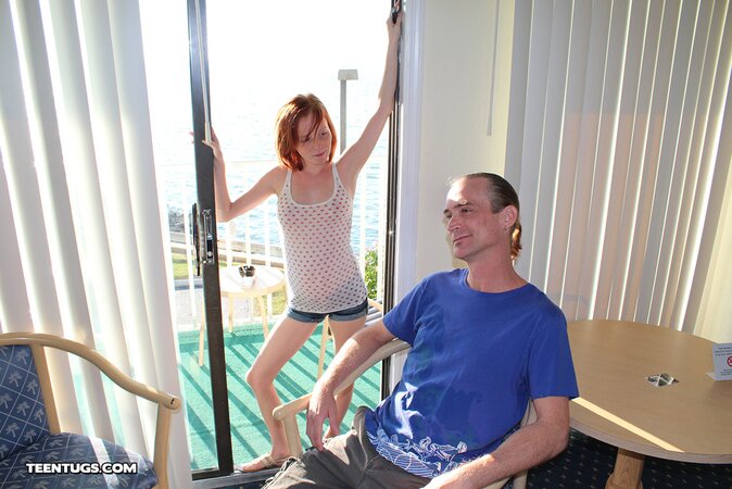 Redheaded babe Alyssa Hart is jerking the guy off happily