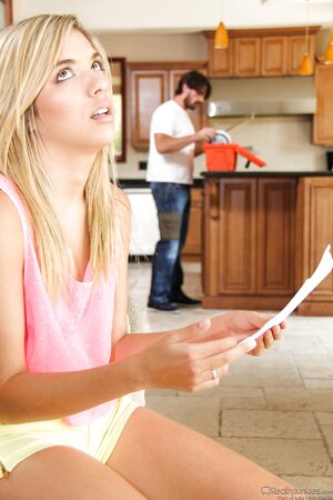 Charming blonde teen seduces handsome plumber at the kitchen while she's alone