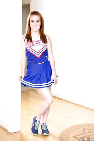 Pale-skinned girl bought sexy cheerleader uniform for hot striptease