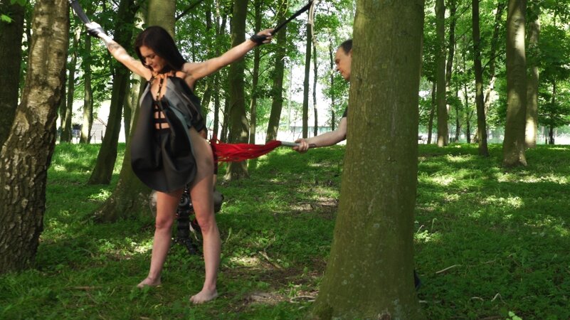 Submissive chick enjoys outdoor bondage domination performed by master