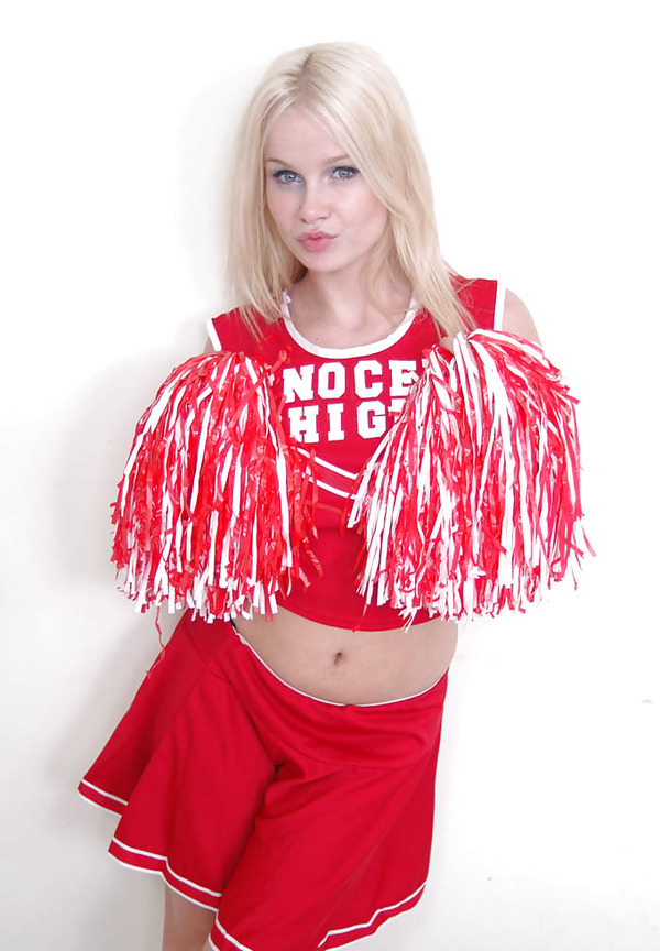 Cheerleader In The Red Innocent High Uniform Gives Upskirt
