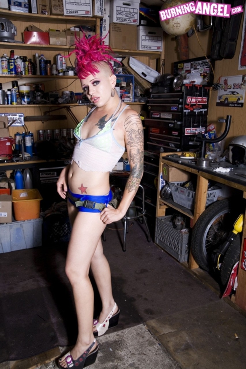 Alt Girl With Bizarre Pink Hairstyle Is Possessor Of Tattoos And