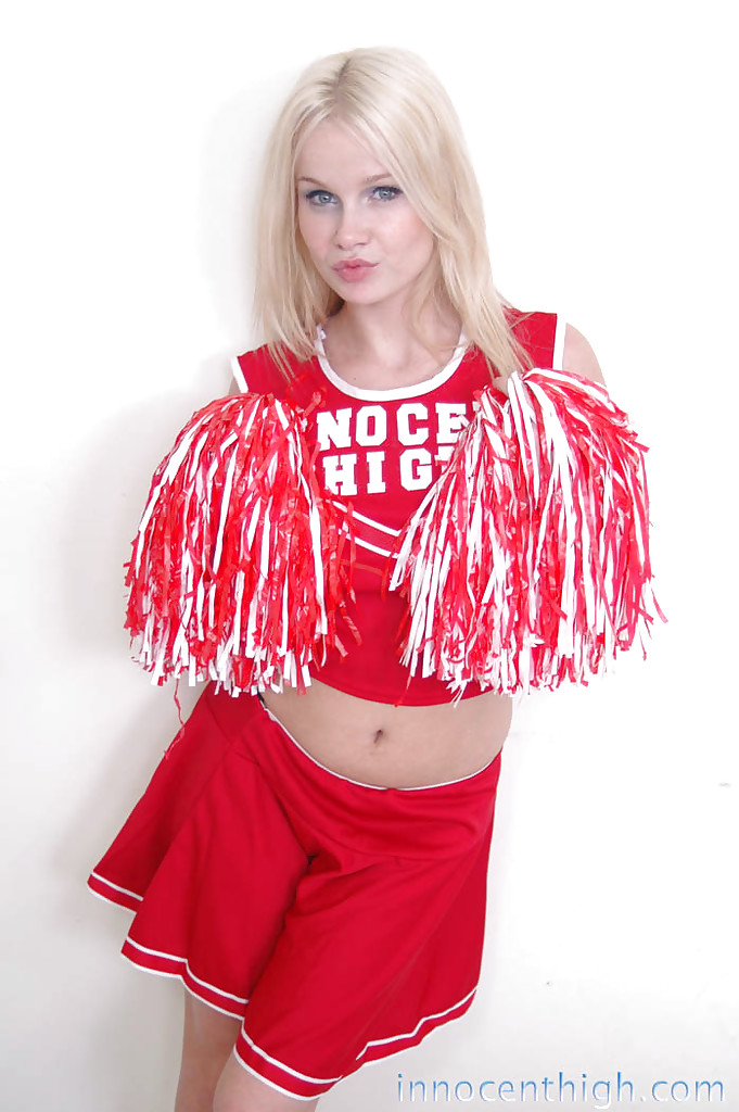 Cheerleader In The Red Innocent High Uniform Gives Upskirt