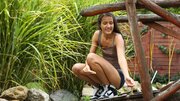 European girl is naked in the field and fingers herself