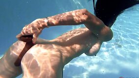 Sofie Marie shoves a big black dildo up her ass near the pool