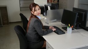 Japanese babe gets tongue and tit play in office restroom