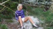 Blonde Teases Her Pussy on a Mossy Cliffside Trail