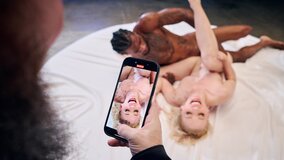 A thick and long black penis fills the pussy of a blonde Milf