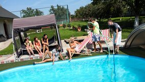 A group of sexy chicks are having a pool party with banging