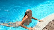 Small titted blonde spreads and fingers pussy poolside