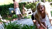 A blonde that has big natural tits is getting fucked outside