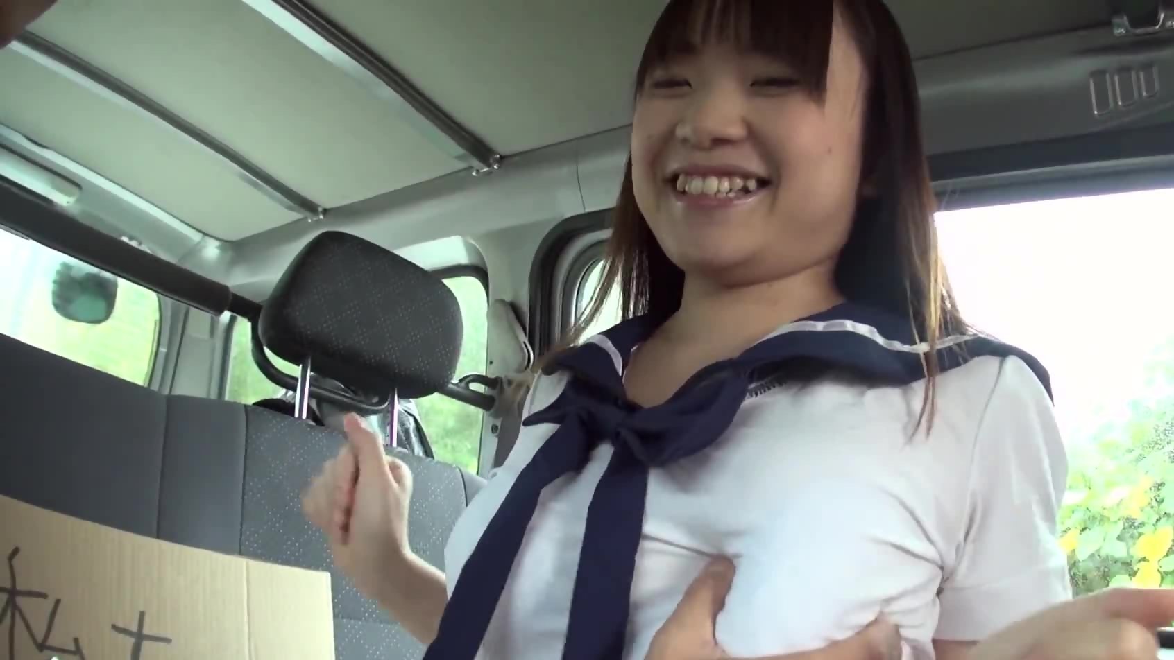 Japanese college girl with big tits gives blowjob in the image