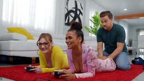 Interracial threesome makes the girls forget about video game