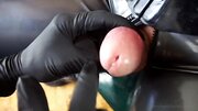 Tied up gimp endures some cock and balls torture by a mistress